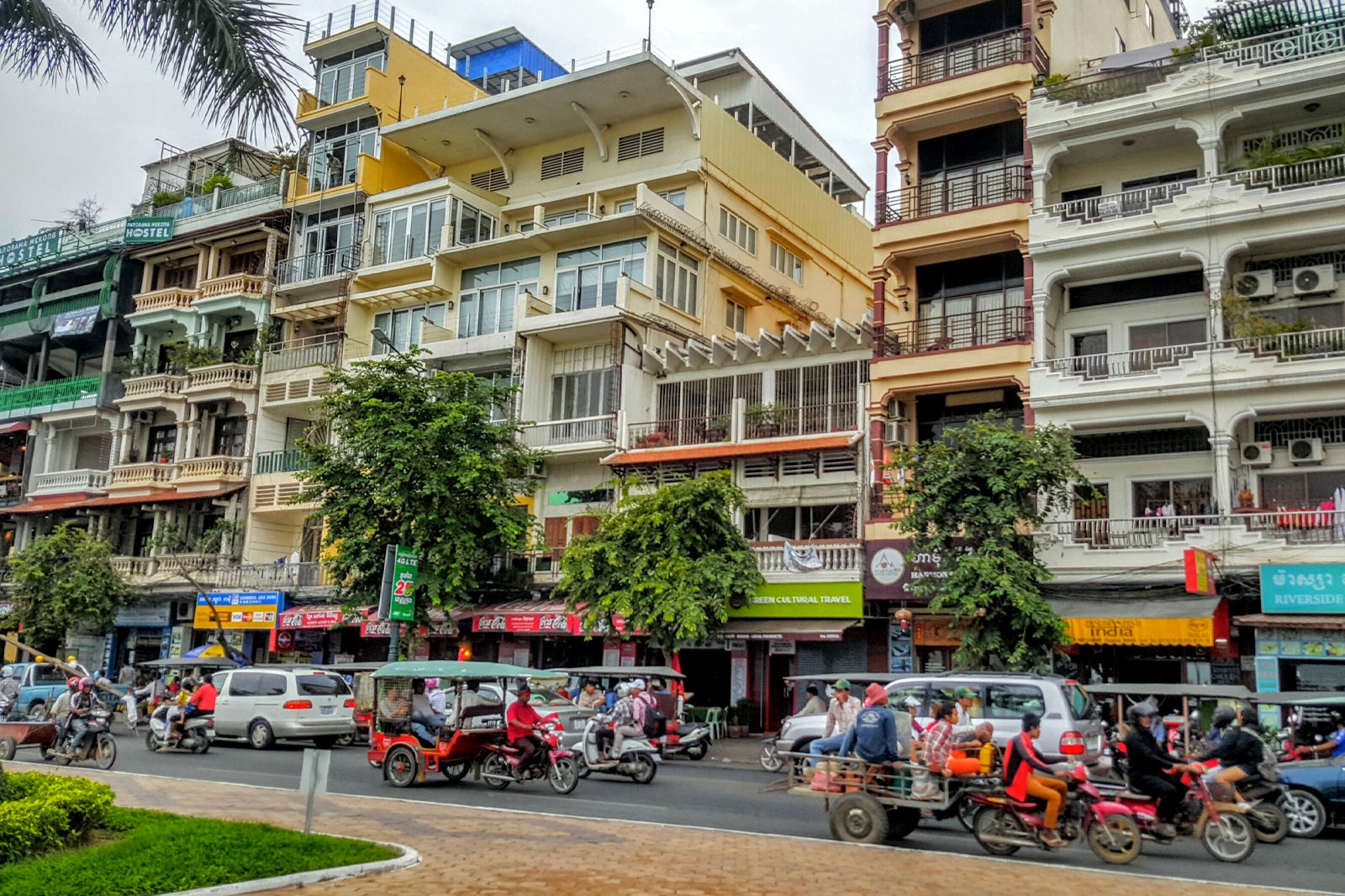 Walking along the riverside in Phnom Penh city in the afternoon 